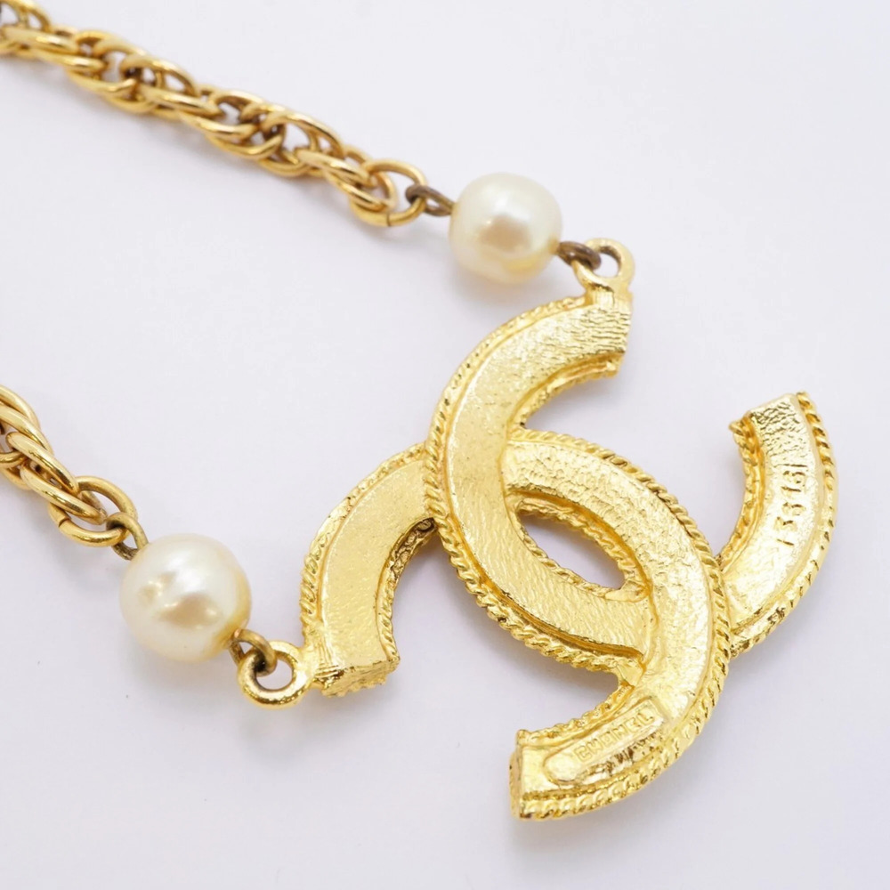 CHANEL Gold Pearl Logo Necklace - Picture 2 of 8
